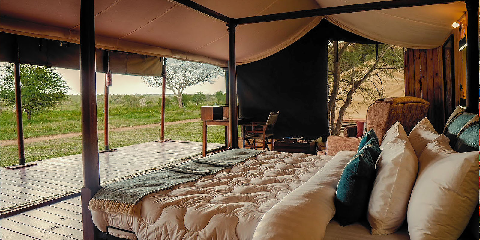Guest tent bedroom opening onto the Serengeti plains