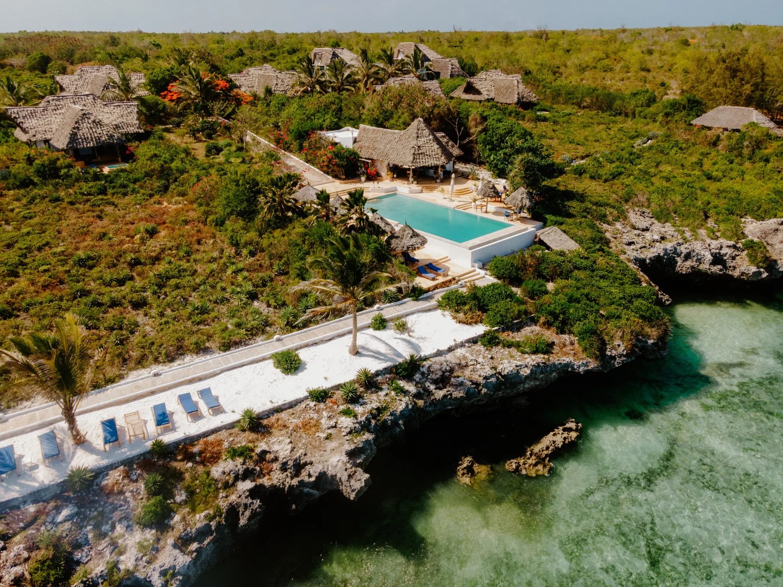 Aerial view of the pool, villas and seafront terrace at Kasha Boutique Hotel