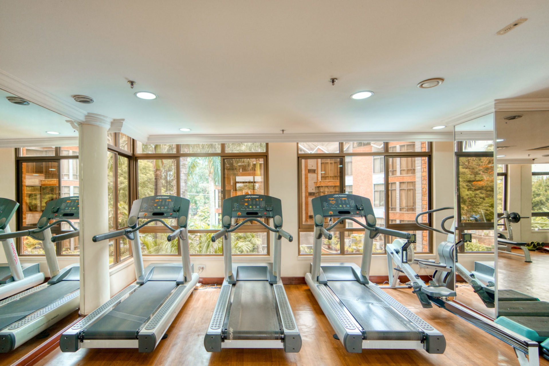 Row of treadmills in the gym at Kibo Palace Hotel