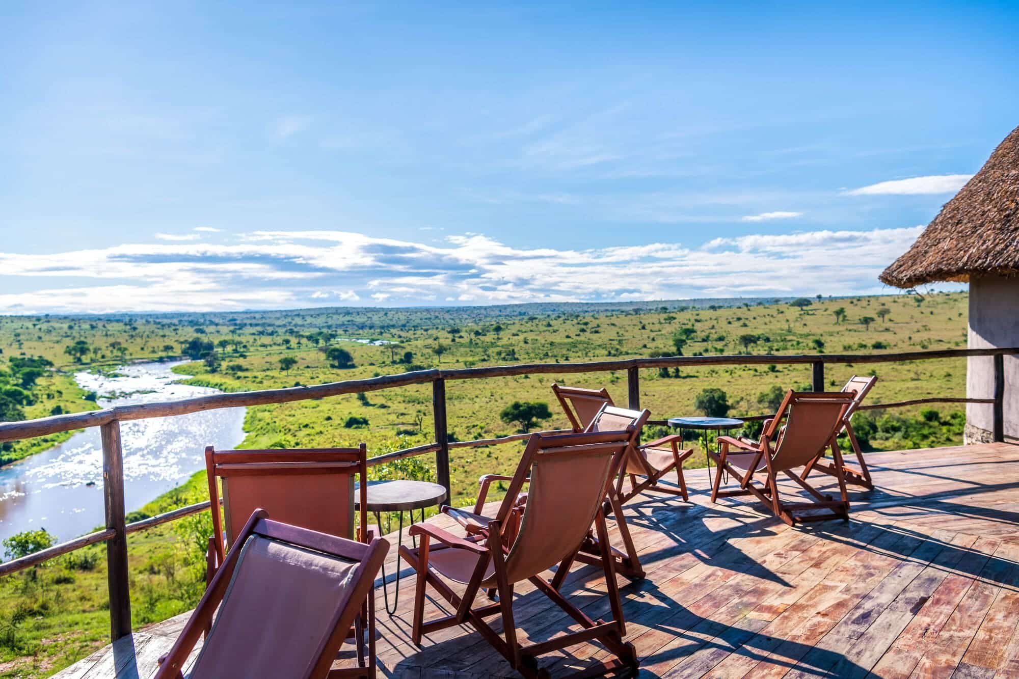 Mara River Post terrace with deck chairs looking down on the bends of the Mara River