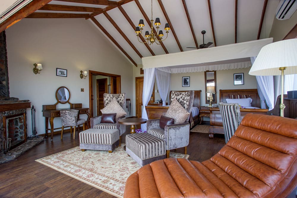 Ngorongoro Oldeani Mountain Lodge, a Standard Room with its fireplace and private deck