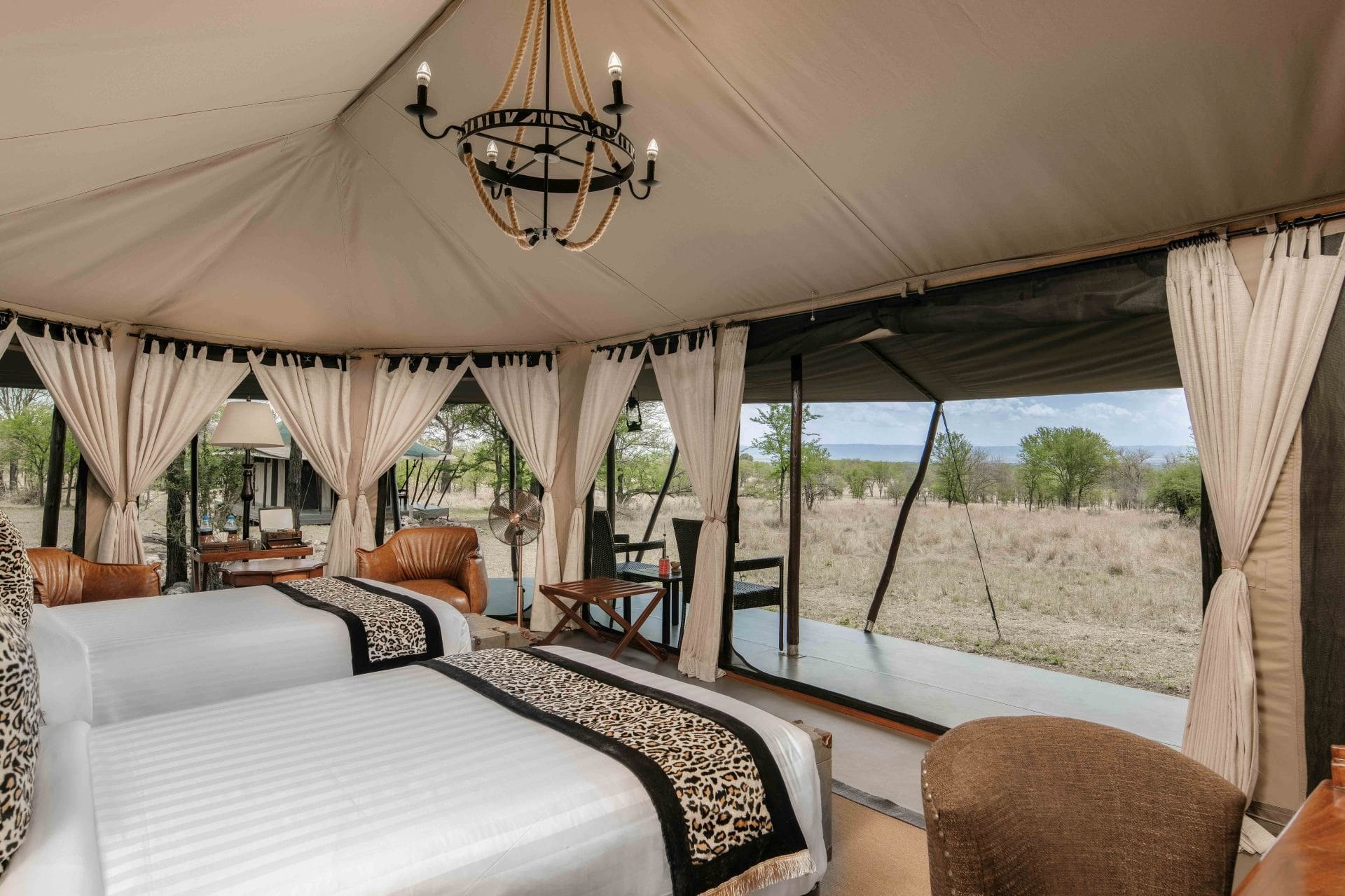Twin beds inside a guest tent at Ole Serai Kogatende