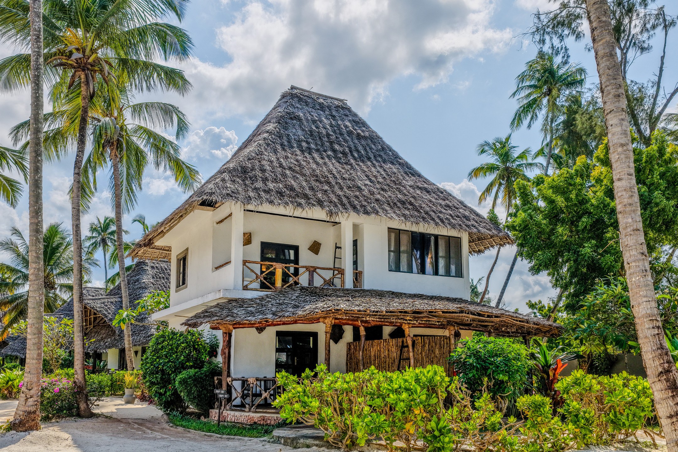 Thatched guest villa set in the gardens at Pongwe Bay Resort