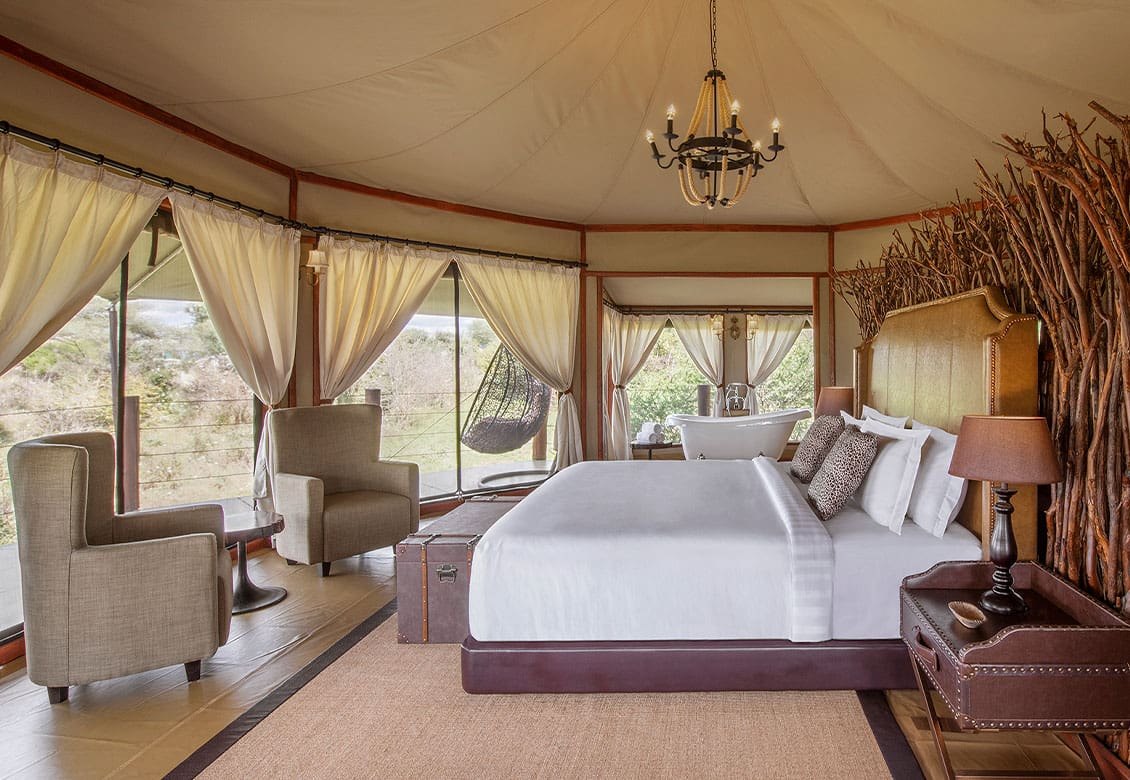 Suite bedroom under canvas at Tarangire Kuro Treetops Lodge