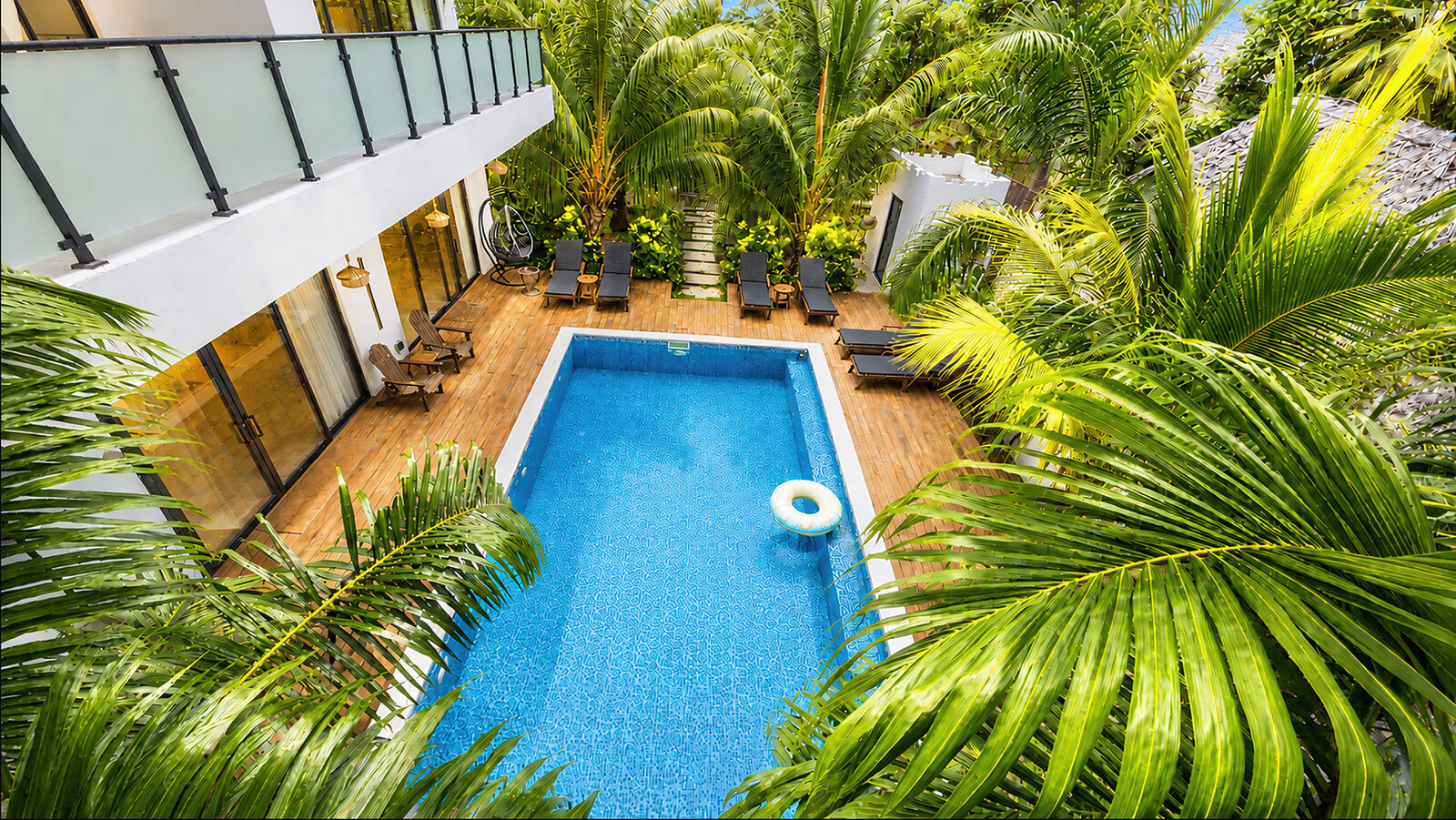 Pool and garden seen from the upper floor at Zoi Beach Luxury Villa